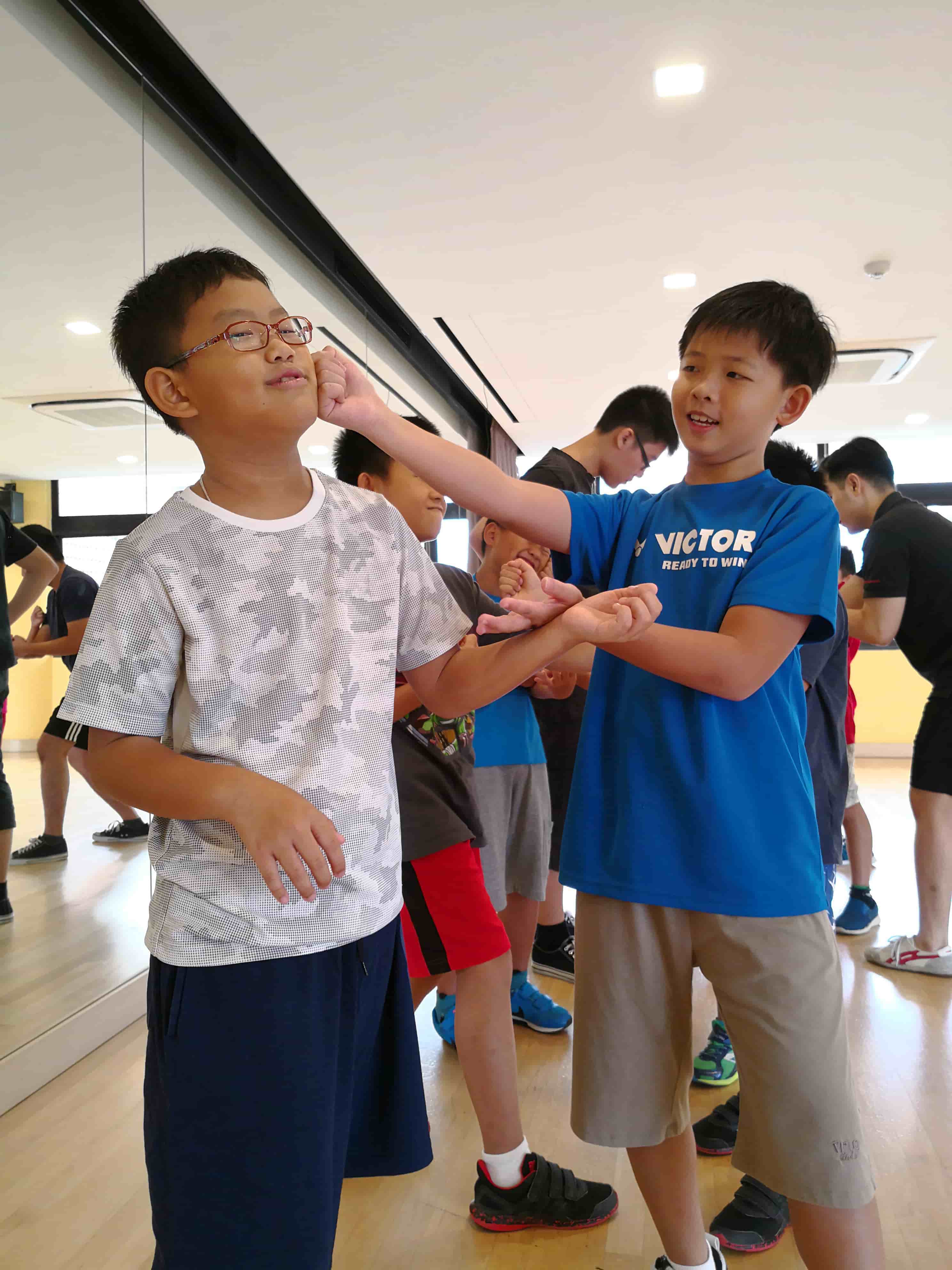 Children learning basic Wing Chun techniques.